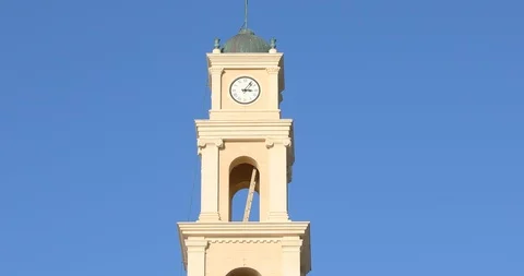 Camera moved down from clock on Monastery to people on Kedumim square Stock-Footage 100368258