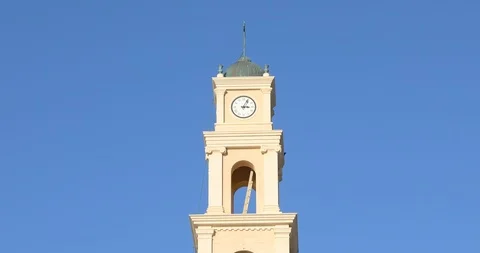 Camera moved down out from clock on Monastery saint Peter to people on square Stock Footage 104271274