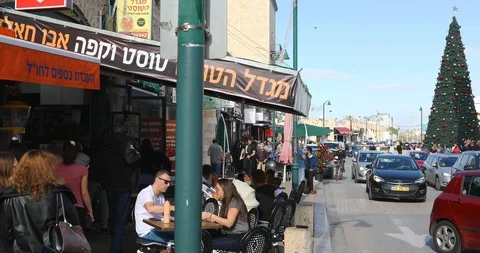 Camera moved from restarant to christmas tree on the square of tower clock Stock Footage 102511434