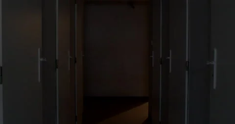 Camera movement along the dark corridor of the technical room of the building. Stock Footage 193777708