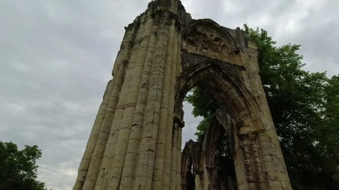 Camera movement along the front of the ruins and  entrance to St Mary's Abbey Stock Footage 248702757