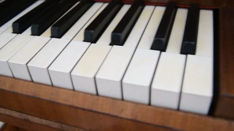 Camera movement along the keys of the old piano Stock Footage 88403828