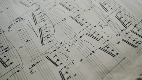 Camera movement along a musical notepad, close up, macro view, slider moving Stock Footage 126863145