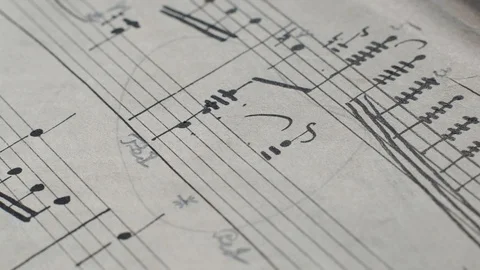 Camera movement along a musical notepad, close up, macro view, slider moving Stock Footage 126863225
