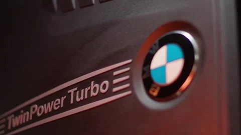 Camera movement along the plastic black cover with the BMW emblem Video stock 254469571
