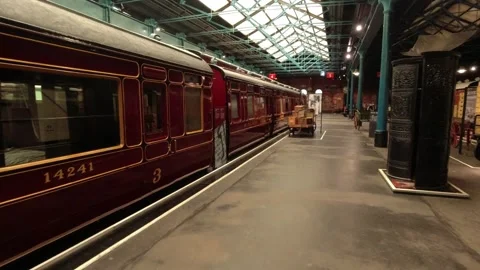 Camera movement along station along with trains - railway museum in york, uk Stock Footage 248993475