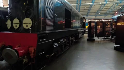 Camera movement along steam and diesel locomotives - railway museum in York, UK Stock Footage 249351796