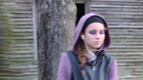 Camera Movement and Soft Focus on Pretty Pre-Teen Girl with Earphones Stock Footage 58696242