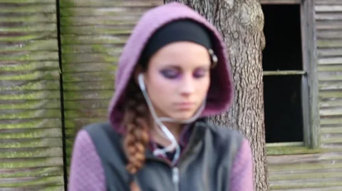 Camera Movement and Soft Focus on Pretty Pre-Teen Girl with Earphones Stock Footage 58696243