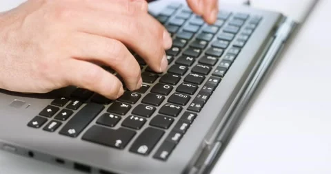 Camera movement around a silver laptop. (RED cinema camera and Otus lenses) Stock Footage 130309188