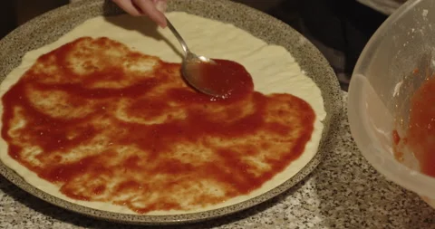 Camera movement on baking tray with pizza being prepared - 4K slow motion Stock Footage 152148469