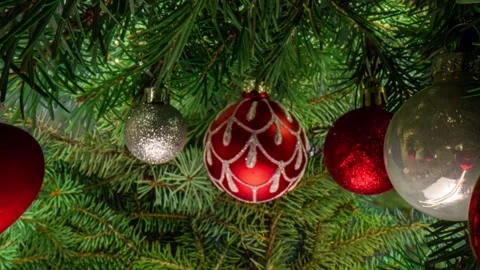 Camera movement between branches and Christmas tree decorations. Christmas Stock Footage 221733103
