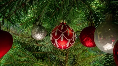 Camera movement between branches and Christmas tree decorations. Christmas Stock Footage 221991235