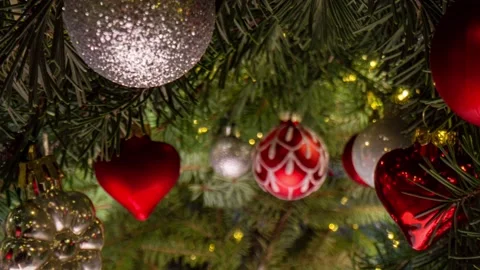 Camera movement between branches and Christmas tree decorations. Christmas Stock Footage 222808949