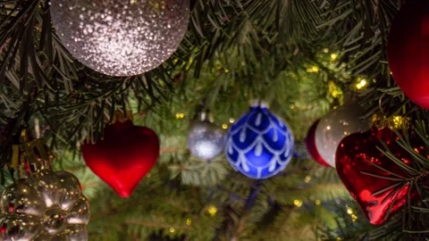 Camera movement between branches and Christmas tree decorations. Christmas Stock Footage 223954538