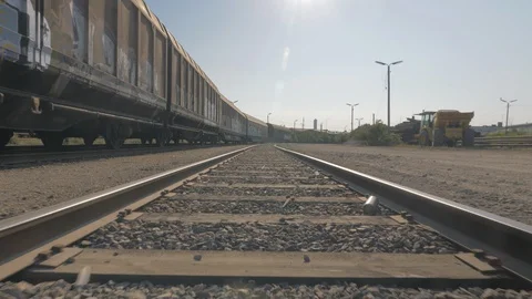 Camera movement between train tracks with wagons Stock Footage 93257645