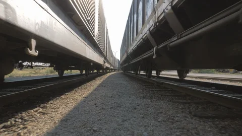 Camera movement between train tracks with wagons Stock Footage 93258069