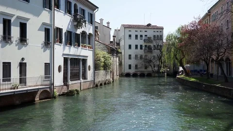 Camera movement from canal between Italian buildings towards the crystal water. Stock Footage 127168917