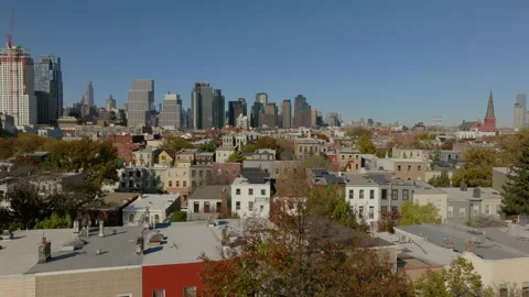 Camera movement captures a street in Williamsburg, Brooklyn, showcasing stunning Stock Footage 302097096