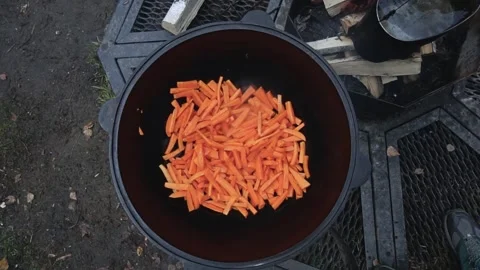 Camera movement to the cauldron with carrots Video stock 169960330