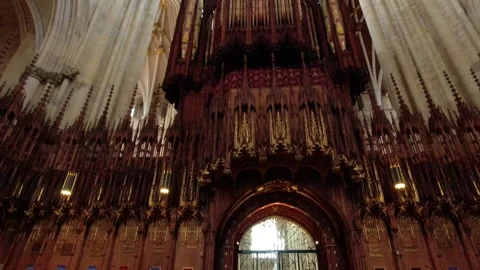 Camera movement from the ceiling and then under the york minster organ Stock Footage 248702724
