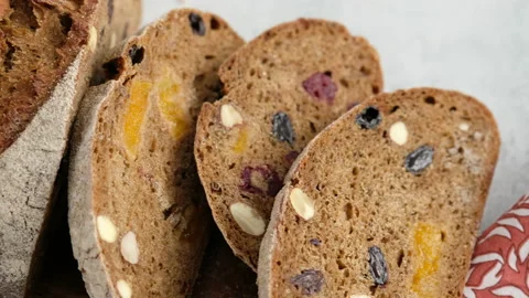 Camera movement. Close up. Beautiful rustic rye bread lies on a wooden board Stock Footage 147031756