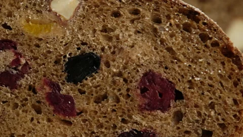 Camera movement. Close up. Beautiful rustic rye bread lies on a wooden board Stock Footage 147032152