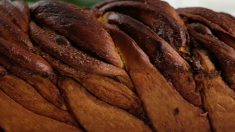Camera movement. A close-up bun with cinnamon and chocolate lies on the wire Stock Footage 152487821