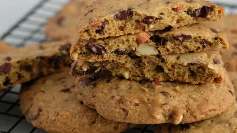 Camera movement. Close-up of a chocolate chip cookie lies on the wire rack. A Stock Footage 145545756