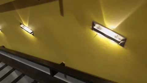 Camera movement down the loft stairs in a modern interior around yellow walls Video stock 111812256