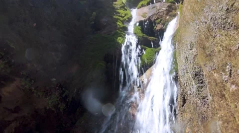 Camera movement downwards_Exotic Waterfall running through valley Stock Footage 40590118