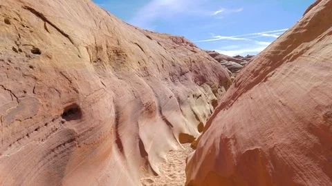 Camera Movement On A Dry Gorge With Smooth And Wavy Rocks Of The Red Canyon 4K Stock Footage 84884636