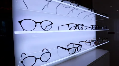 Camera Movement Eyeglasses Shelf . Stand With Glasses in the Store Of Optics . Stock Footage 146032483