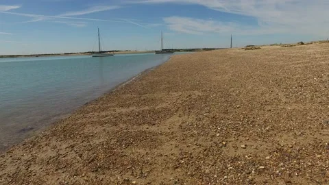 Camera movement forward on Mersea Island beach Stock Footage 146695924