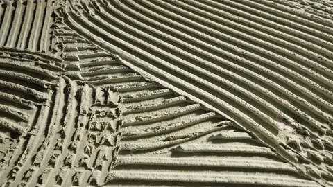 Camera movement by fresh concrete tehture with patterns of notched trowel. Macro Stock Footage 227570637