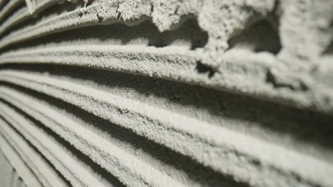 Camera movement by fresh concrete tehture with patterns of notched trowel. Macro Stock Footage 227571504