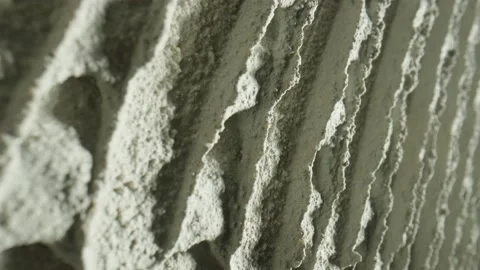 Camera movement by fresh concrete tehture with patterns of notched trowel. Macro Stock Footage 227572619