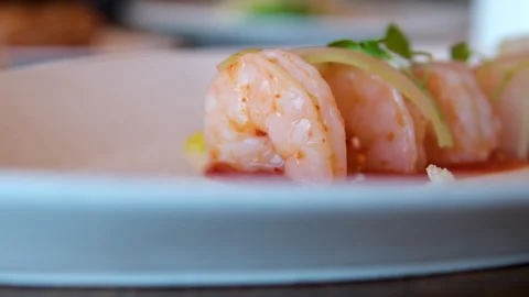 Camera movement of fried prawns in sweet and sour sauce with garlic spices and Stock Footage 295059158