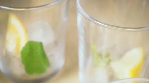 Camera movement on a glass with ice and mint slow motion Video stock 87755613