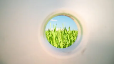 Camera movement inside a plastic bottle overlooking a beautiful landscape Stock Footage 284770751