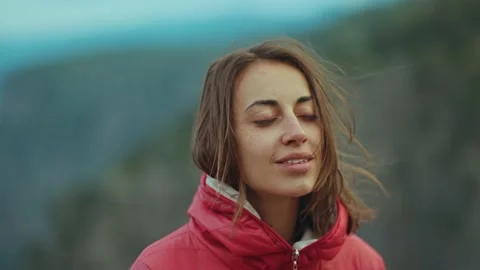 Camera movement out from close up portrait of Beautiful young woman performing a 스톡 동영상 221949967