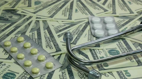 Camera movement over medicaments and dollars Stock Footage 89535503