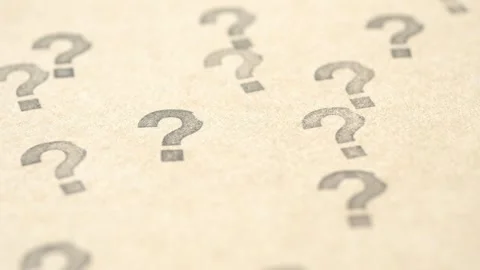 Camera movement over paper sheets with printed question marks symbols in ma.. Stock Footage 332746671