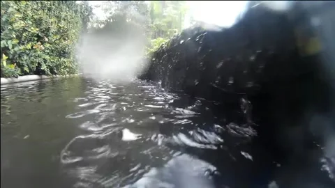 Camera movement over a pool of water, with raindrops Stock Footage 146563732