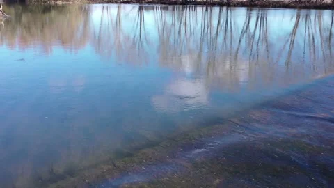 Camera movement over the water of a river flowing through a rapids. Stock Footage 261996454