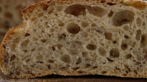 Camera movement. Sliced bread lies on a wooden board. Baking bread. Cooking the Stock Footage 145492432