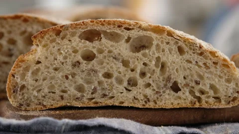 Camera movement. Sliced bread lies on a wooden board. Baking bread. Cooking the Video stock 146906849