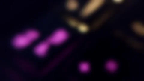 Camera movement through the gamer's glowing multi-colored keyboard Video stock 242108433