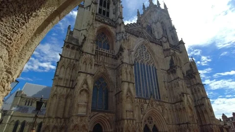 Camera movement from under the arch of the two towers of York Minster Stock Footage 248625173
