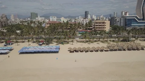 Camera movement from the view of the resort town to the beach and sea waves Stock Footage 112787525